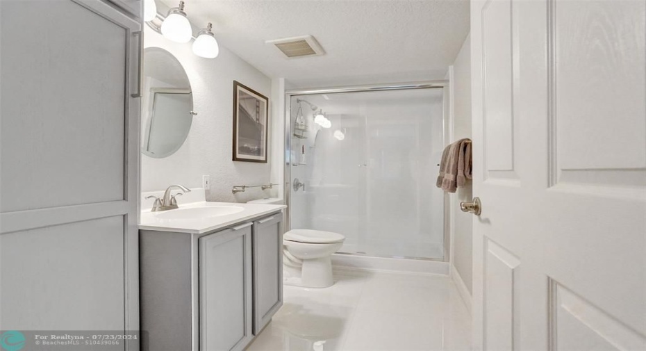 Oversized shower and linen closet