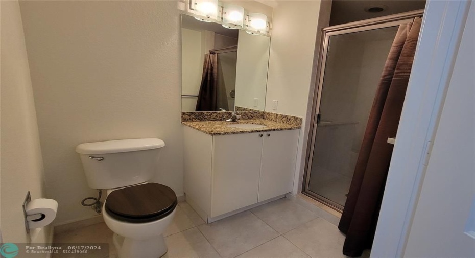 Secondary BathroomWalk-In Shower & Granite Countertops