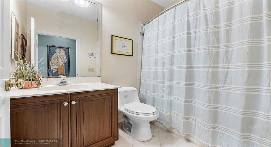 full bathroom adjacent to downstairs guest room
