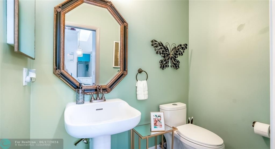 Discover the convenience of this centrally located half-bath, nestled between the kitchen and the living area. Perfect for quick access during gatherings or everyday use.