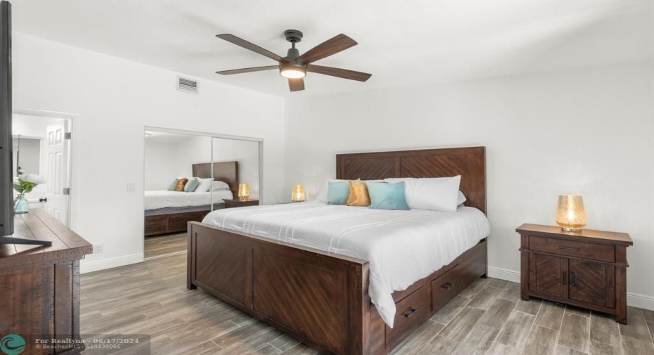 Owners Suite Bedroom with Mirrored Doors to Walk In Closet