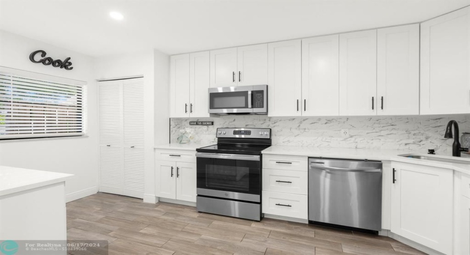 Fully Updated Kitchen with Quartz Counters and Stainless Steel Appliances