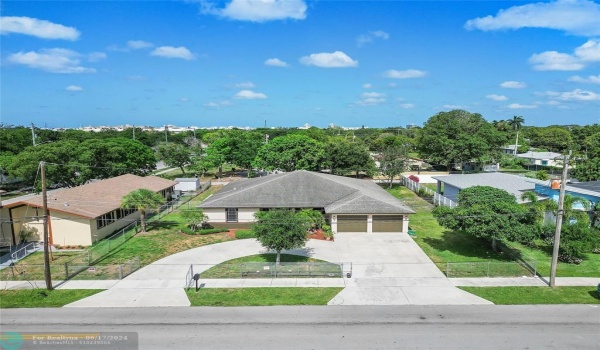 fenced yard and circular drive in addition to two car garage