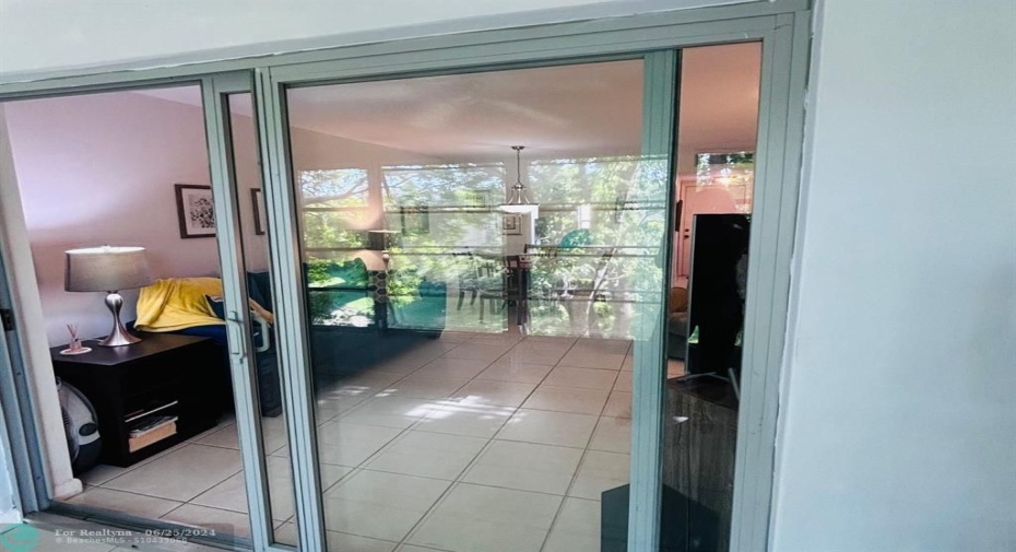 Impact Sliding Doors lead out to enclosed Patio