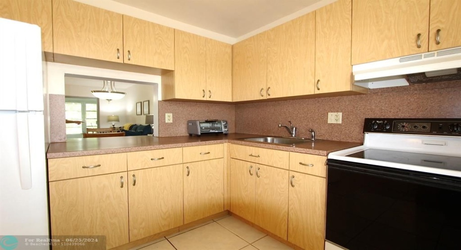 Updated Kitchen with pass-thru to dining room.    Lots of cabinets-good storage.