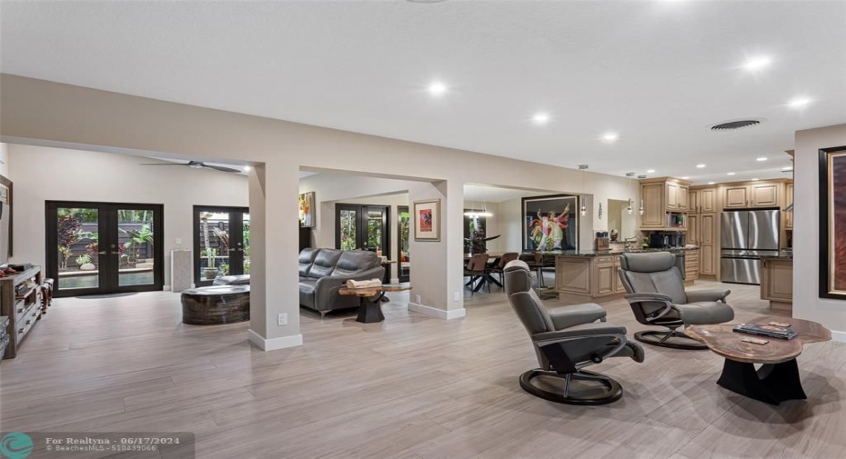 Upon entry, an open floor plan is warm and welcoming.
