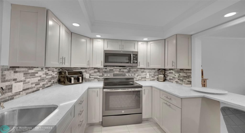 beautiful open Kitchen with granite countertops.