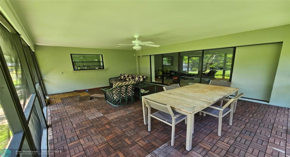 Screened Patio Under ROOF, Could be a Kitchen if converted.