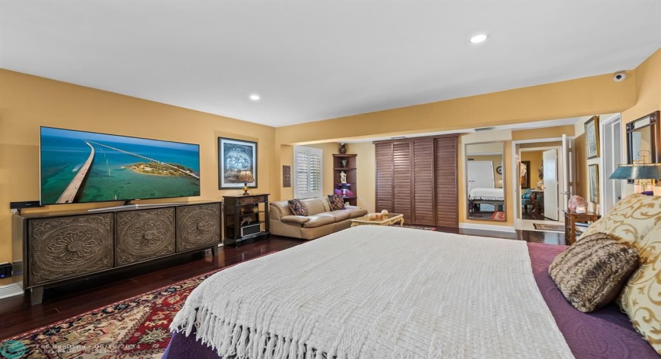Primary suite features two large walk-in closets and a sitting area.