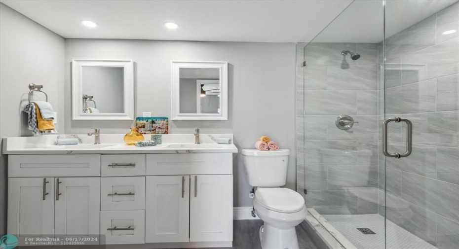 REMODELED PRIMARY BATH WITH DOUBLE SINKS AND SEAMLESS SHOWER