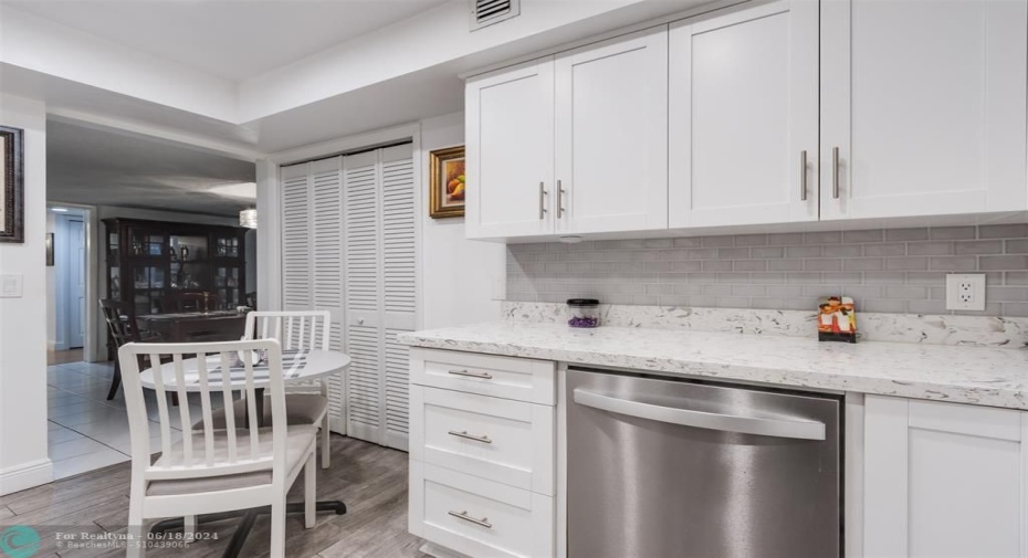 The laundry room is conveniently located in the kitchen at the entrance to the kitchen