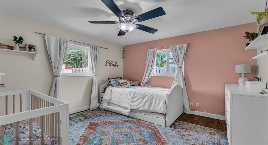 Second bedroom with great natural light and ceiling fan with lighting