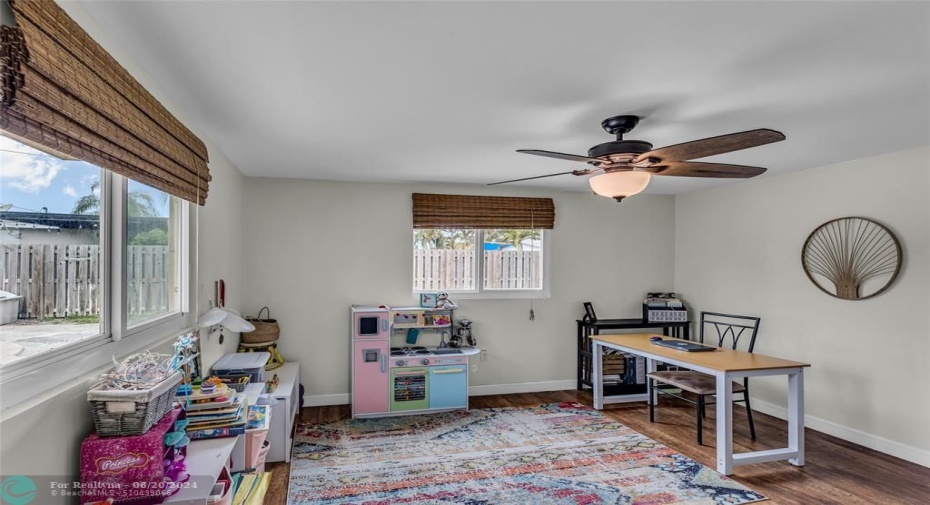 Third Bedroom with an abundance of natural light and woof like flooring