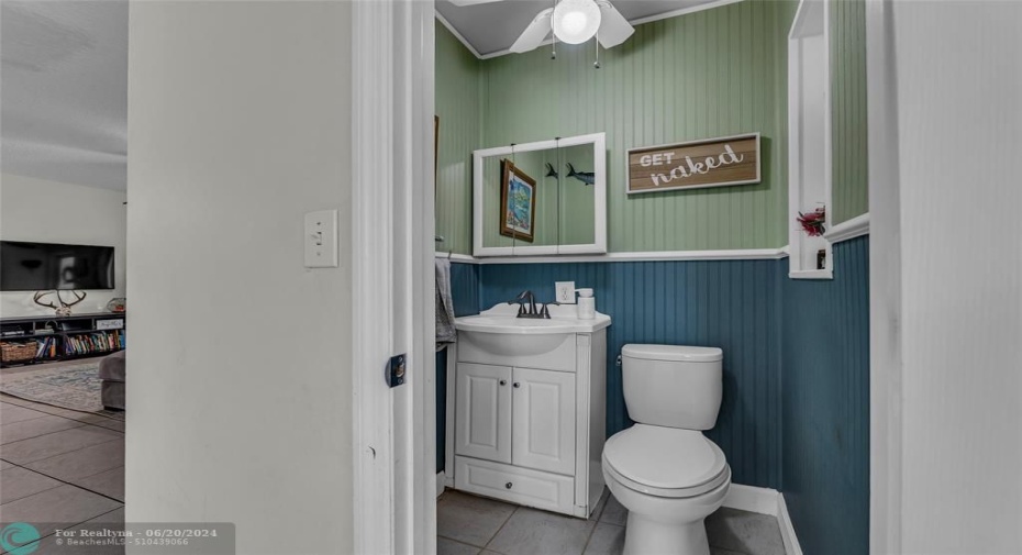 Bathroom offers a tub / shower combo with custom sink and vanity