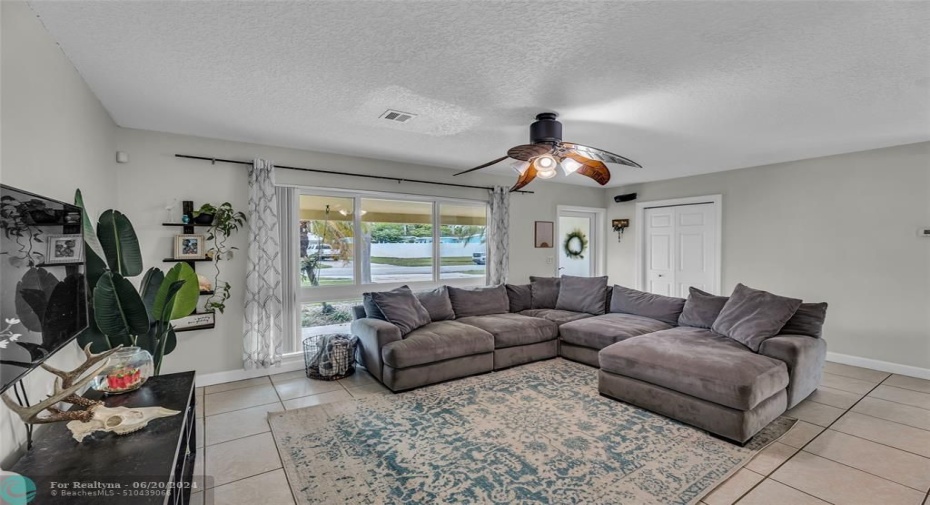 Open and spacious living room upon entry with great natural light