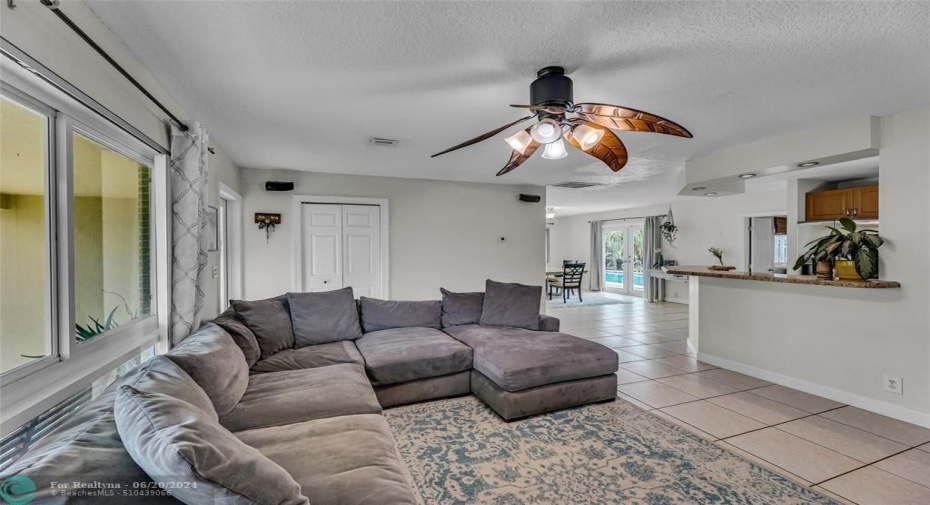 Living room  open into kitchen with large breakfast bar