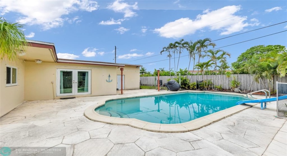 enjoy entertaining in this great backyard with pool and slide