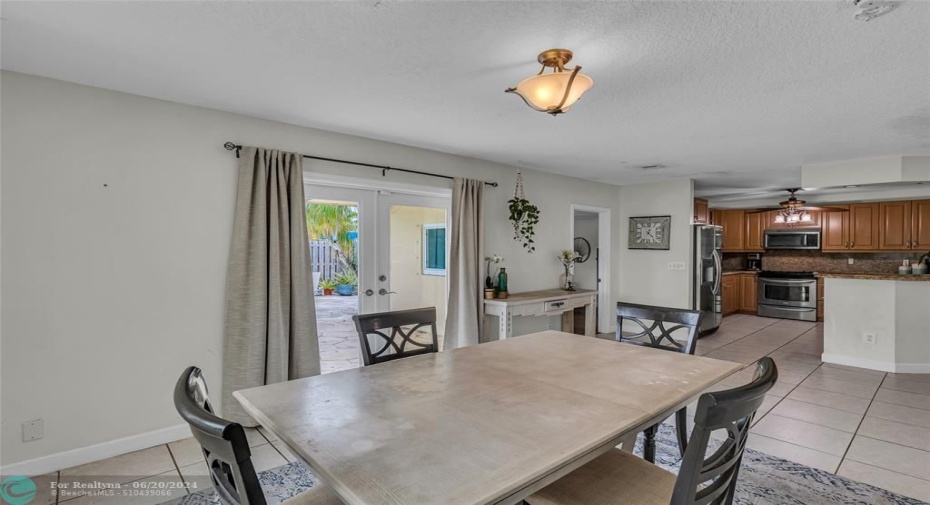 Kitchen is open with stainless steel appliances and oak wood cabinets