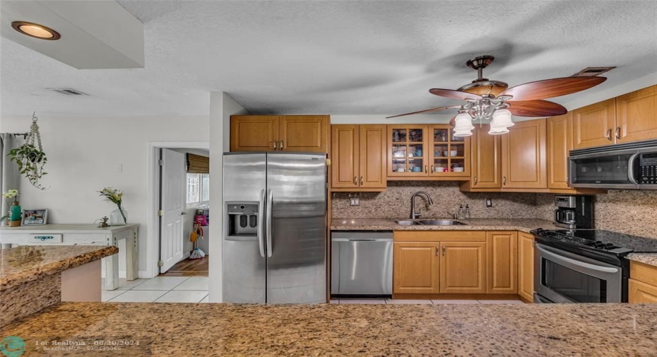 Living Room offers an abundance of natural light and opened to kitchen with large breakfast bar