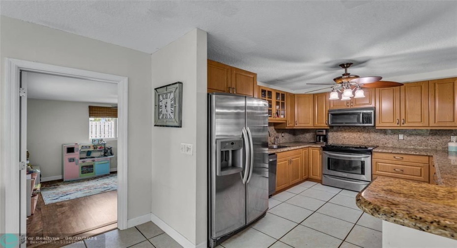Kitchen offers wood cabinets and stainless appliances