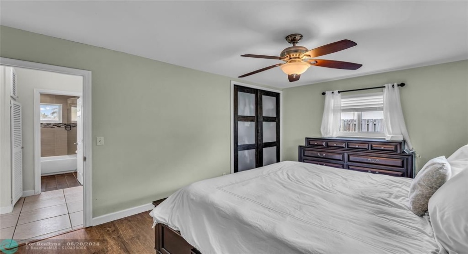 Master Bedroom with woodlike flooring and great natural light