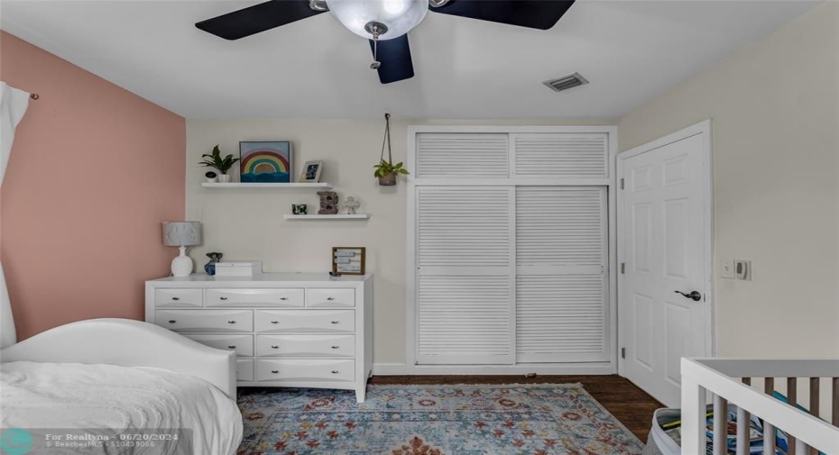 Master Bedroom with woodlike flooring and great natural light