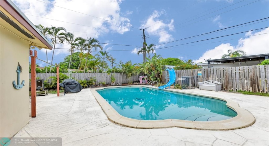 Back yard offers private fenced back yard and pool