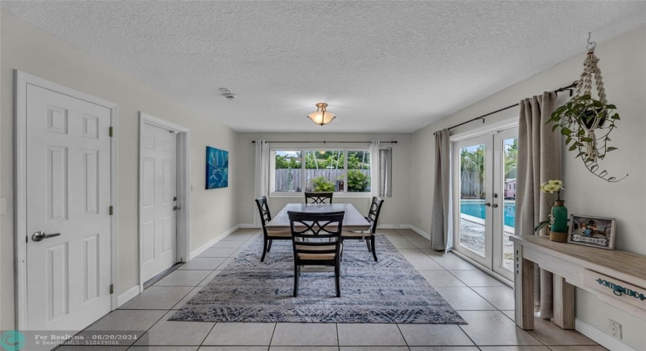 Dining Room with an abundance of natural light and French doors to pool and backyard