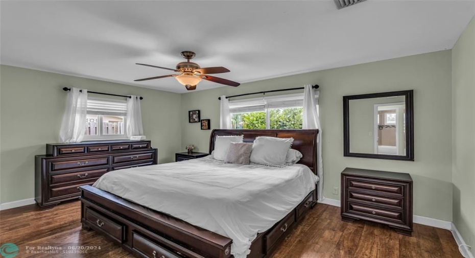 Master Bedroom with great natural light and wood like flooring