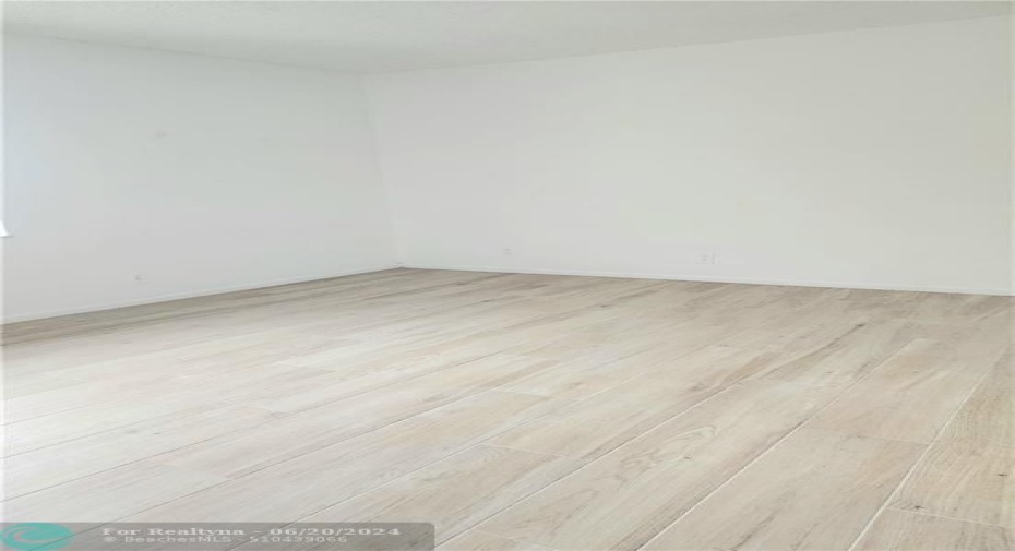 primary bedroom with new plank tile flooring