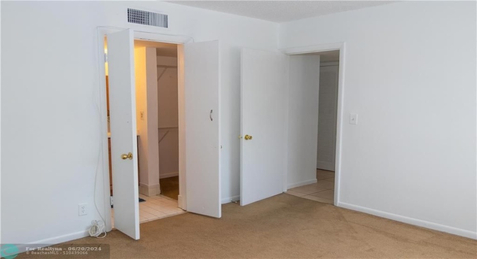 primary bedroom-carpet out, brand new plank tile flooring in