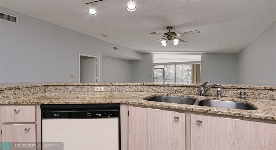 Open Kitchen with Snack Bar Double Stainless sink and dishwasher