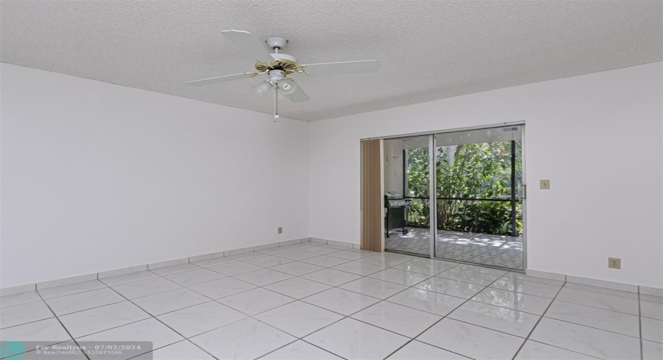 With Ceiling gan and access to Roofed and Screened Patio and Tiled Flooring