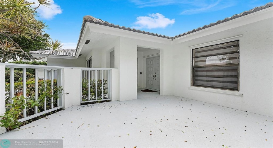 Spacious front open patio area at entry