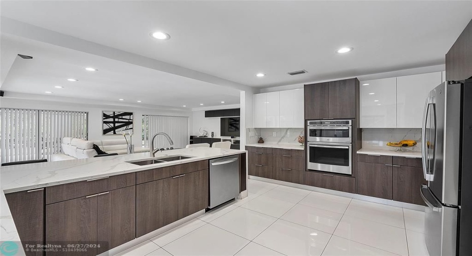 Chef's kitchen with wall oven and microwave, stainless steel appliances