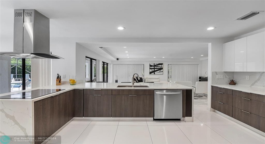 Chef's kitchen with wall oven and microwave, stainless steel appliances, ceramic cook top and vent hood