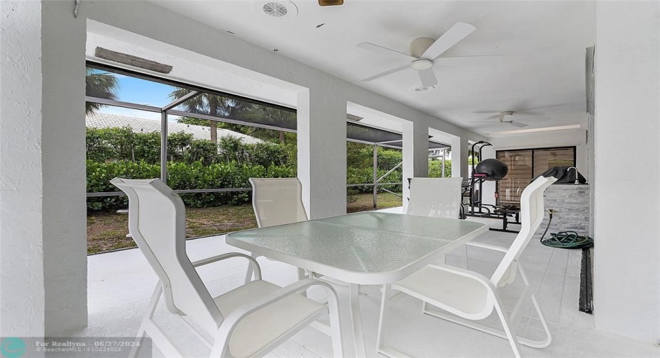 Enjoy outside living on your roofed wrap around patio adjacent to the screen enclosed pool