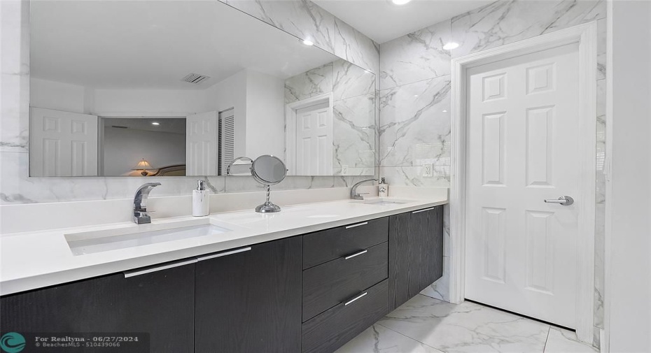 Completely updated primary bath with double sink vanity