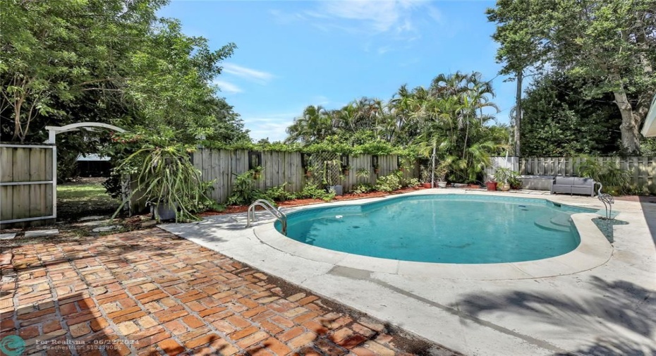 Enjoy your pool, BBQ area and large yard