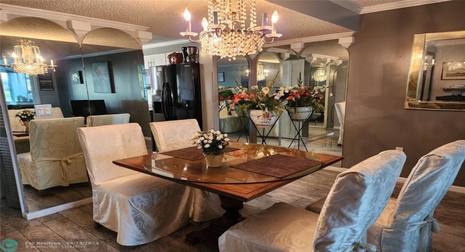 Furnished Dining Room Area with Chandelier