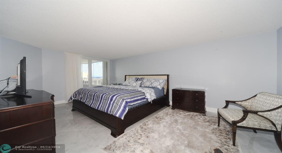 Master Bedroom is spacious with tile flooring and great natural light
