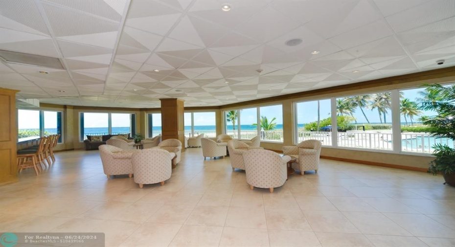 Clubhouse and common area is wall to wall windows offering ocean and pool views