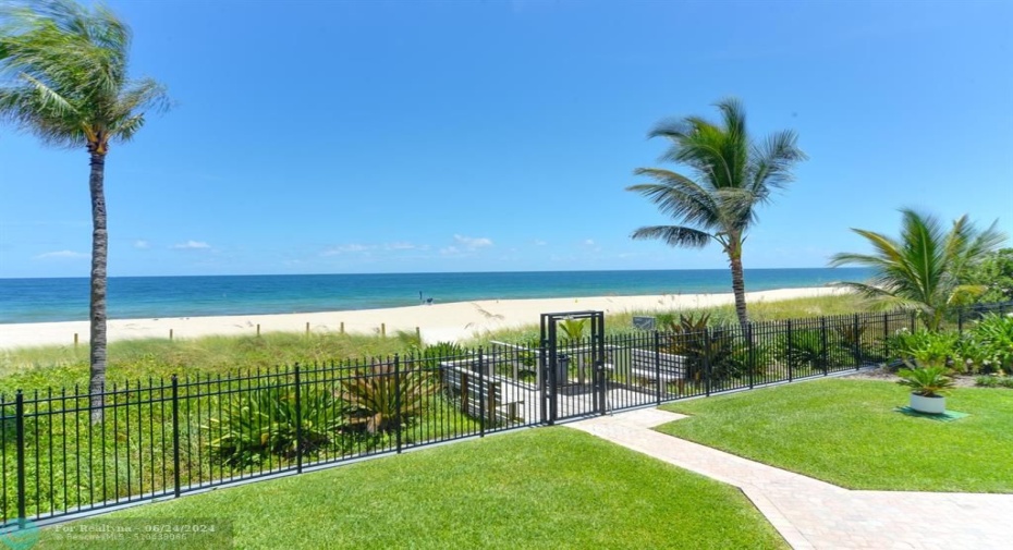 Private Beach access with meticulous landscaping and gorgeous green space