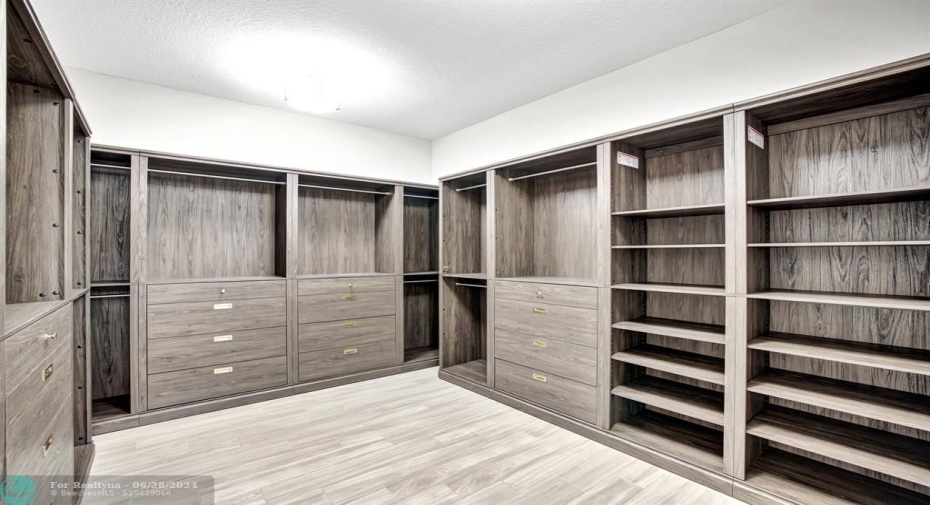 Primary closet with Scott Living custom shelving