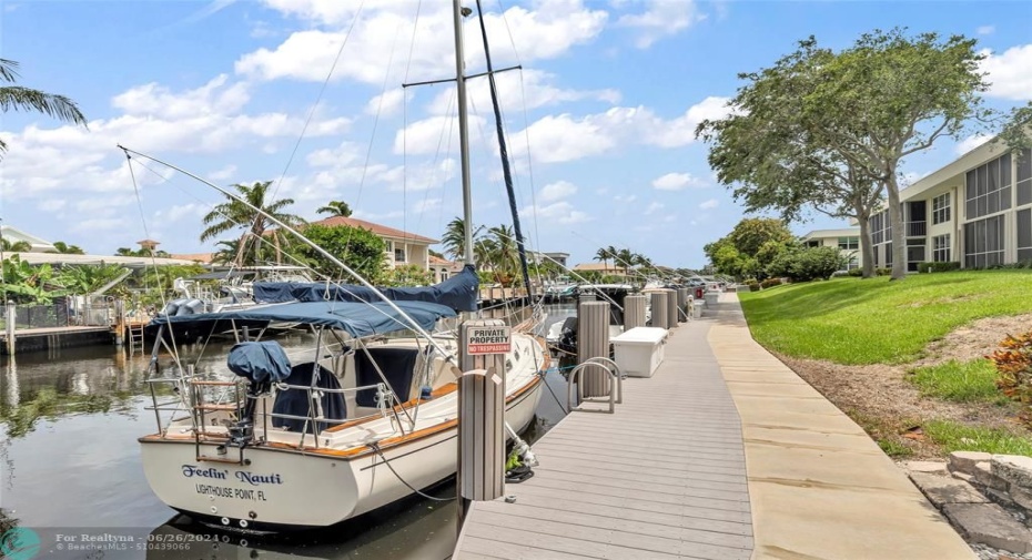 Enjoy this wide dock and walk space right behind your unit and get on the waiting list for your boat to be right behind your condo