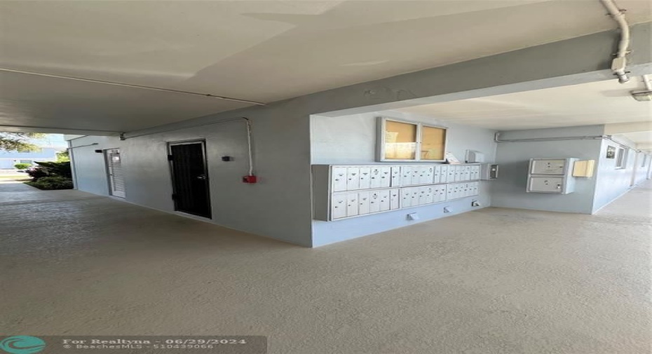 MAILBOXES AND LAUNDRY LOCATED IN CENTER OF BUILDING