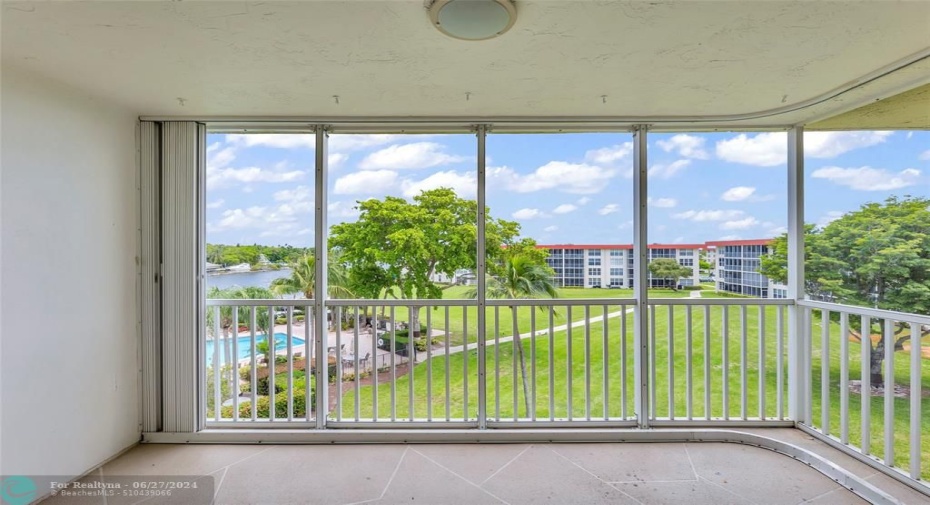 Screened Porch with Intracoastal and pool views is the perfect place to relax and enjoy