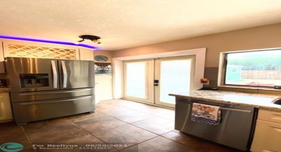 Stainless Steel Appliances. French doors with built in blinds lead to back patio.Pass through window to patio.