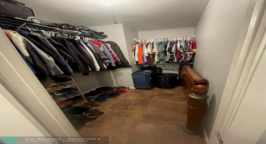 oversized walk-in closet in master bedroom