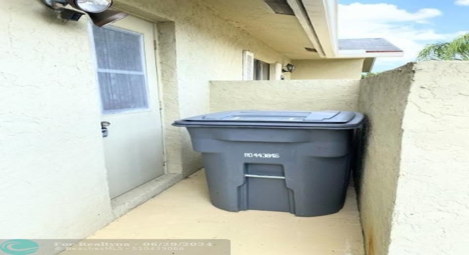 Private entrance into Laundry Room form Driveway. Hidden garbage can storage.